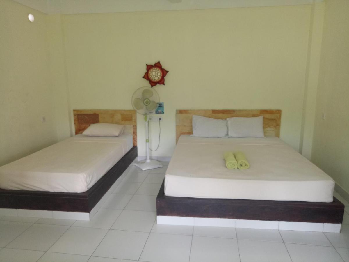 Amed Stop Inn Homestay, Rooftop Restaurant And Bar ภายนอก รูปภาพ